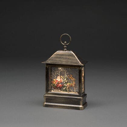 Vattenfylld lykta tomtesläde